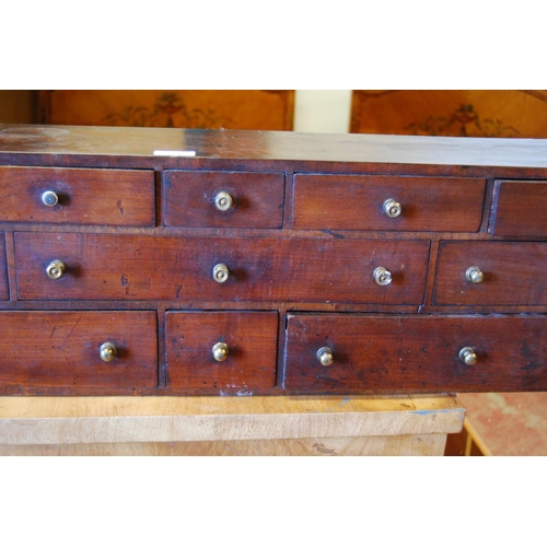 383 - Set of George III mahogany collector's drawers with eleven assorted deep drawers, 25cm high, 92cm wi... 