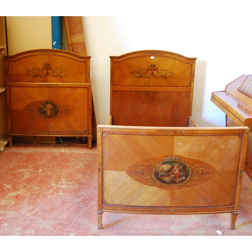 386 - Pair of French Empire-style walnut single beds decorated with painted classical panels of floral scr... 