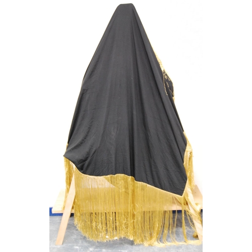 165 - Silk shawl, in plain black silk with gold brocade-style tasselled fringe, approximately 110cm x 100c... 