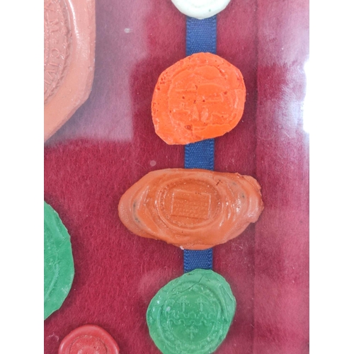 193 - Fifteen framed 18th & 19th century wax postage seals to include a city seal (possibly Prussian) ... 