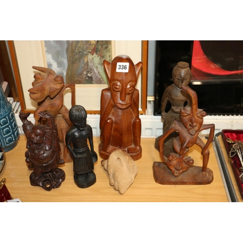 336 - Carved African figures, and a bust.  (7)