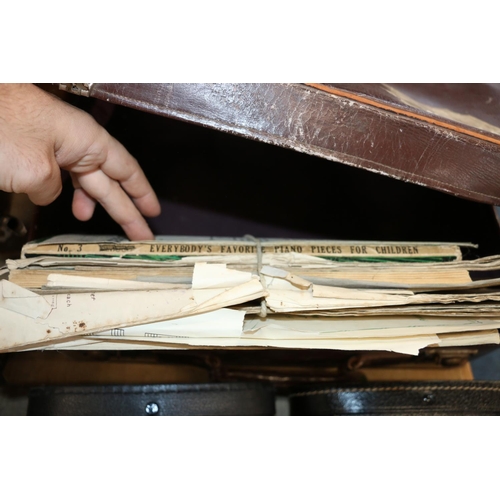 390 - Vintage leather style case containing sheet music.