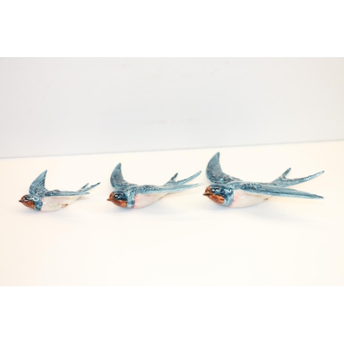 39 - Set of three Beswick swallows.