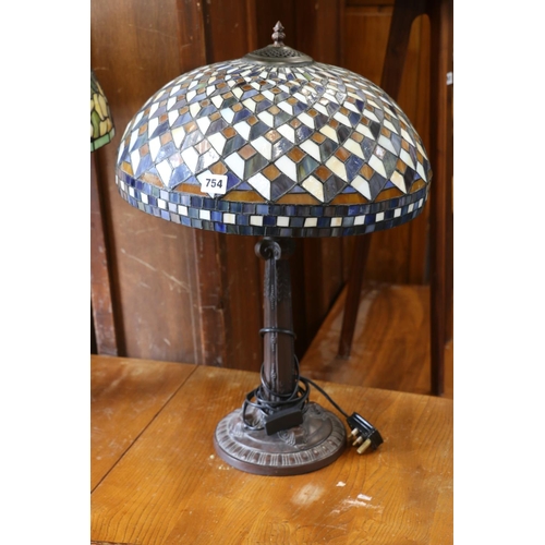 754 - Tiffany style table lamp with leaded glass shade.