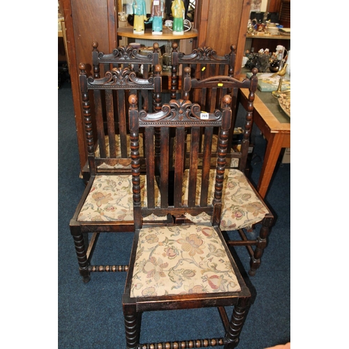 769 - Set of five oak slat back dining chairs.