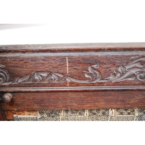 359 - 19th century continental carved oak hall bench decorated with carved floral, fruit, vine and acanthu... 