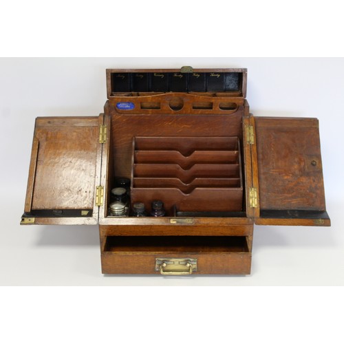 247 - Late 19th/early 20th century oak stationery/writing box of rectangular form, the sloping front with ... 