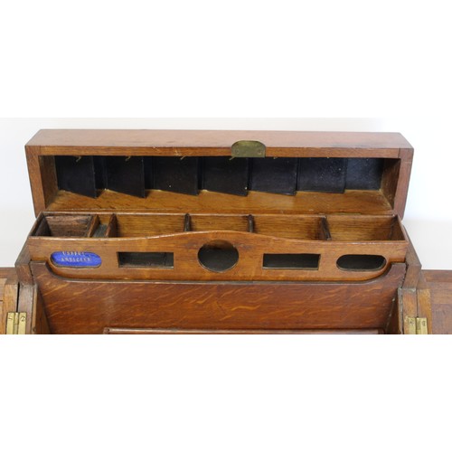 247 - Late 19th/early 20th century oak stationery/writing box of rectangular form, the sloping front with ... 