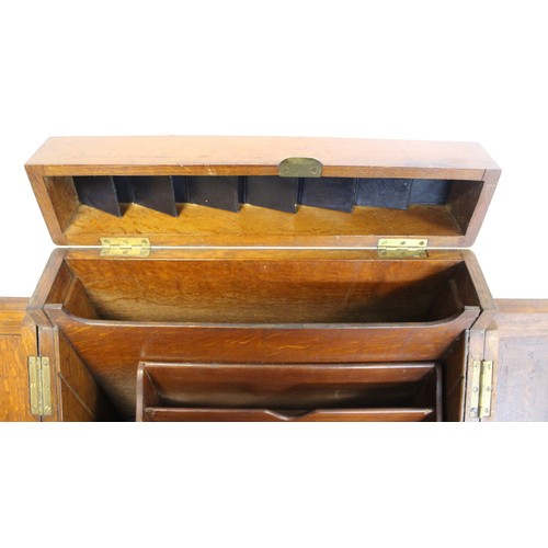 247 - Late 19th/early 20th century oak stationery/writing box of rectangular form, the sloping front with ... 