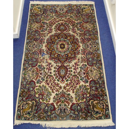 190 - Persian Qum (Qom) rug, the cream field with central flowerhead lozenge, floral sprays and border wit... 