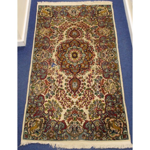 190 - Persian Qum (Qom) rug, the cream field with central flowerhead lozenge, floral sprays and border wit... 