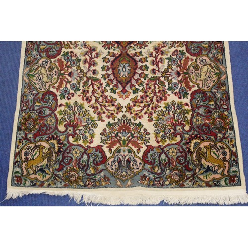 190 - Persian Qum (Qom) rug, the cream field with central flowerhead lozenge, floral sprays and border wit... 