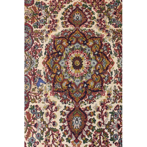 190 - Persian Qum (Qom) rug, the cream field with central flowerhead lozenge, floral sprays and border wit... 