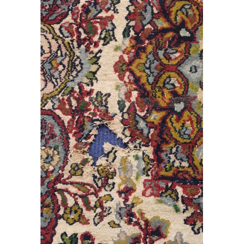 190 - Persian Qum (Qom) rug, the cream field with central flowerhead lozenge, floral sprays and border wit... 