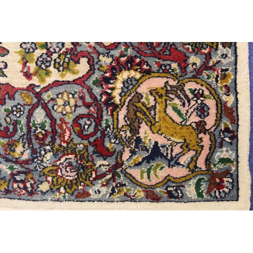 190 - Persian Qum (Qom) rug, the cream field with central flowerhead lozenge, floral sprays and border wit... 