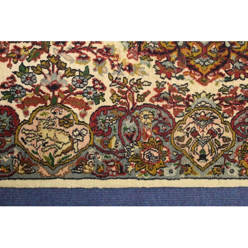 190 - Persian Qum (Qom) rug, the cream field with central flowerhead lozenge, floral sprays and border wit... 