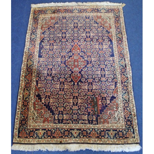 192 - Persian Bijar (Bidjar) rug with central lozenge on blue field with stylised floral medallions, spand... 