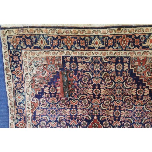 192 - Persian Bijar (Bidjar) rug with central lozenge on blue field with stylised floral medallions, spand... 