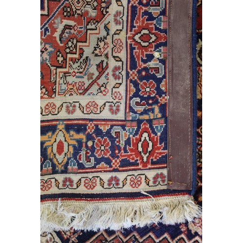 192 - Persian Bijar (Bidjar) rug with central lozenge on blue field with stylised floral medallions, spand... 