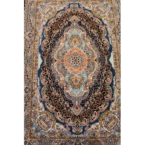 193 - Modern machine woven Kashan artificial silk rug with central floral lozenge, spandrels of vases of f... 