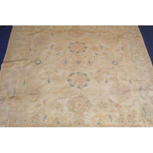 194 - Turkish Usak (Oushak) wool on cotton carpet, the cream ground with pale pastel floral and scroll dec... 