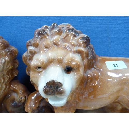 21 - Pair of Bo'ness glazed lion figures.