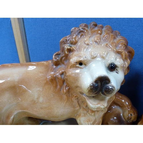 21 - Pair of Bo'ness glazed lion figures.