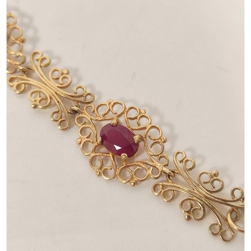 19 - Gold bracelet with six oval rubies on openwork, '9k', 6.6g.