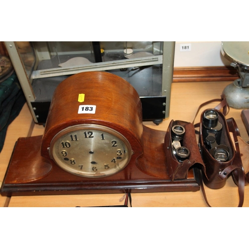 183 - Mahogany cased mantel clock, pair of opera glasses and a cased pair of binoculars.