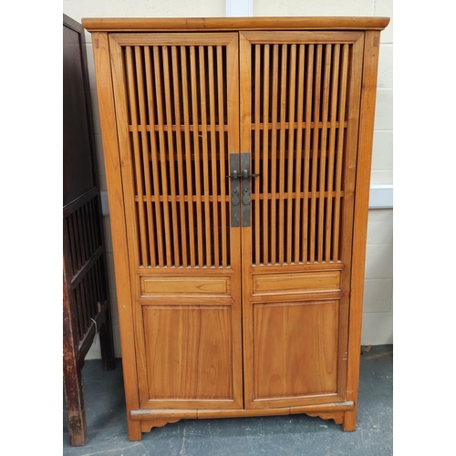 473 - Chinese elm food cupboard, with large slatted doors enclosing a shelved interior with metal locking ... 