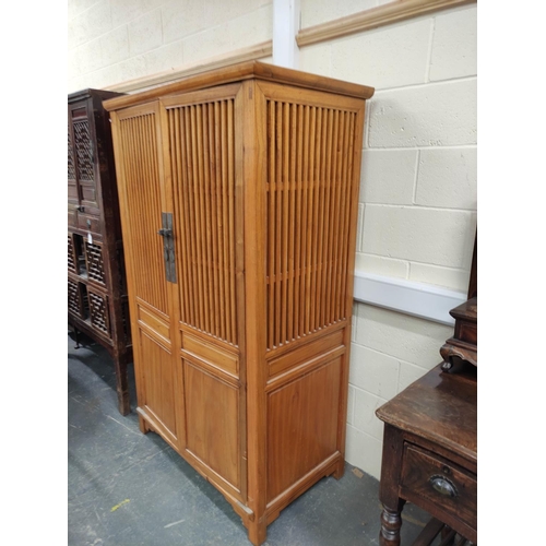 473 - Chinese elm food cupboard, with large slatted doors enclosing a shelved interior with metal locking ... 