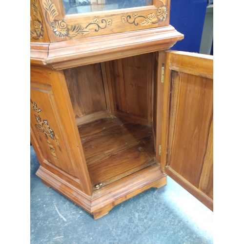 477 - Pair of modern Chinese glazed display cabinets of octagonal form, the glazed door, enclosing two gla... 