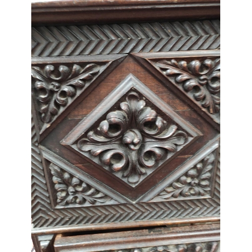 478 - Continental carved coffer, the hinged rectangular top with metal lock and escutcheon, carved profuse... 