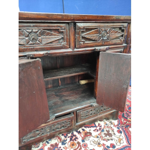 483 - Chinese lacquer altar cabinet, of sleigh form, with two small carved drawers above two doors enclosi... 