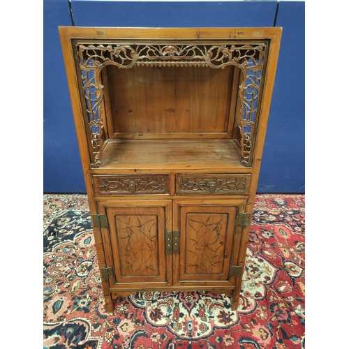 485 - Chinese pine cupboard, with an open section to the top, decorated with Chinese fretwork, above two s... 