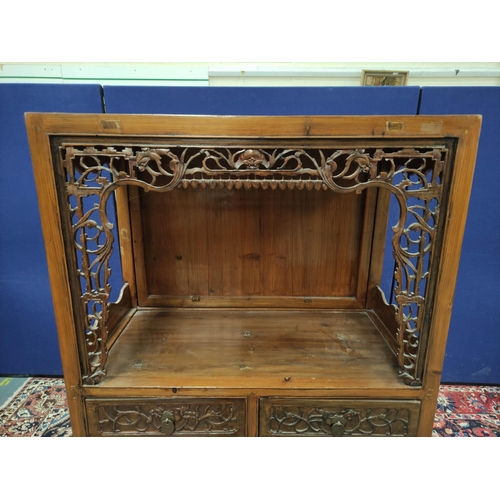 485 - Chinese pine cupboard, with an open section to the top, decorated with Chinese fretwork, above two s... 