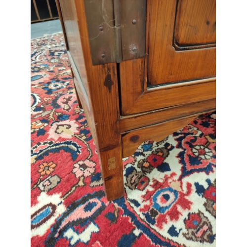 485 - Chinese pine cupboard, with an open section to the top, decorated with Chinese fretwork, above two s... 