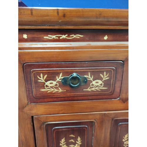 486 - Chinese inlaid hardwood cupboard with a three-quarter gallery above three short drawers and two door... 