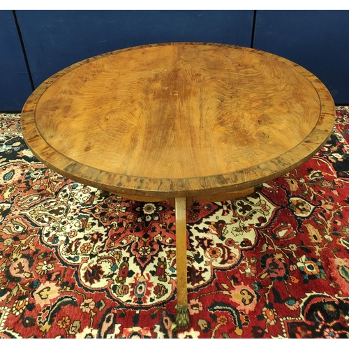 487 - Mahogany breakfast table, the circular snap-action top on a turned column and tripod supports, with ... 