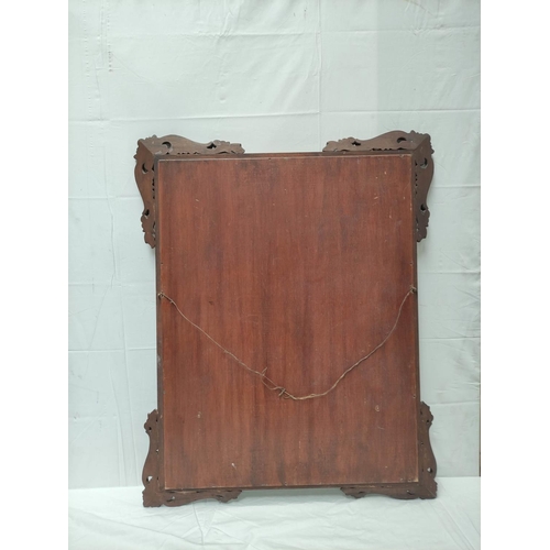 493 - Chinese hardwood wall mirror decorated with shell and acanthus moulded appliques. 96cm high, 77cm wi... 