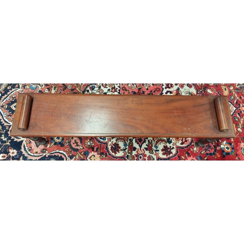 494 - Late Victorian mahogany hall bench with a cylindrical scroll terminal to either side of the seat, on... 