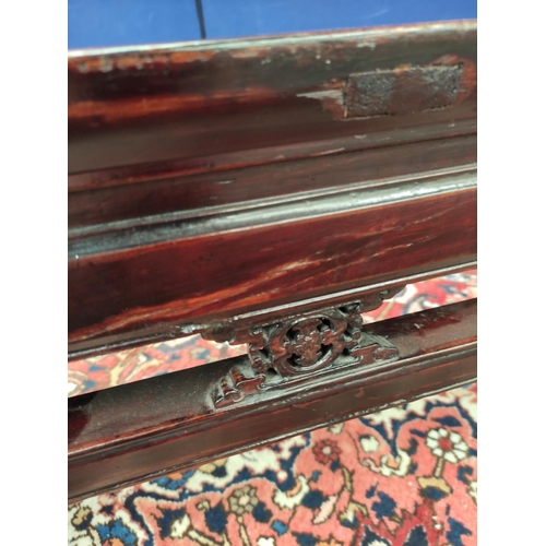 495 - Antique Chinese lacquer bench, the rectangular top with pierced frieze sides and fret scrolls above ... 