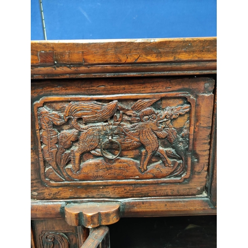 497 - Antique Chinese Shanxi carved elm cabinet, With two deep drawers above two cupboard doors decorated ... 