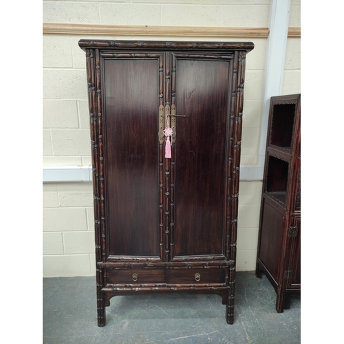 498 - Antique Chinese lacquer cabinet, With two large doors enclosing a shelved interior, above two small ... 