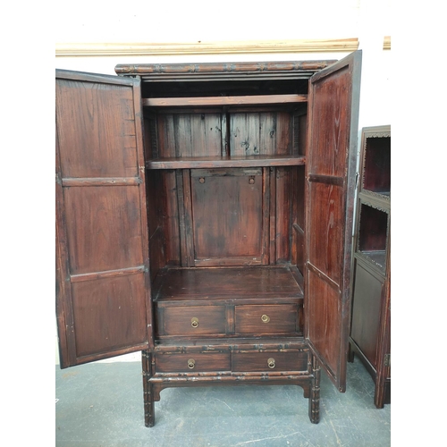 498 - Antique Chinese lacquer cabinet, With two large doors enclosing a shelved interior, above two small ... 