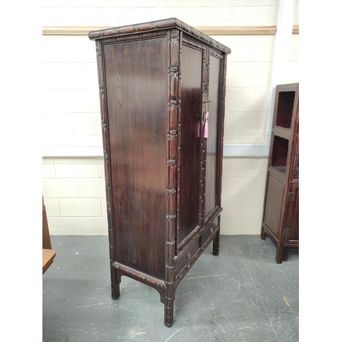 498 - Antique Chinese lacquer cabinet, With two large doors enclosing a shelved interior, above two small ... 