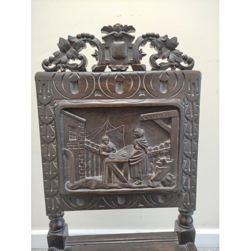 506 - Jacobean revival carved oak hall chair, with a carved leaf and scroll surmount, above carved panel d... 