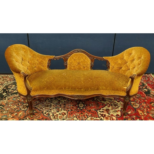 509 - Victorian mahogany scroll end settee upholstered in later gold coloured button back dralon, decorate... 