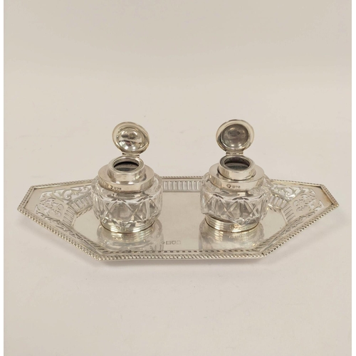 149 - Silver inkstand, pierced with angled ends and two oval cut glass receivers by Huttons, 1906, weight ... 