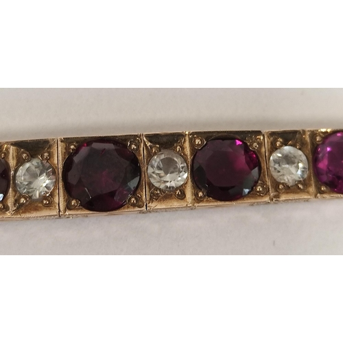 80 - Continental gold bracelet with garnets and white spinels, 8.7g gross.